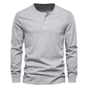 Detailed front view of a gray long-sleeved Henley shirt featuring a classic 3-button placket