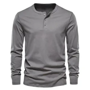 Detail view of a grey long-sleeved Henley t-shirt featuring a classic button placket