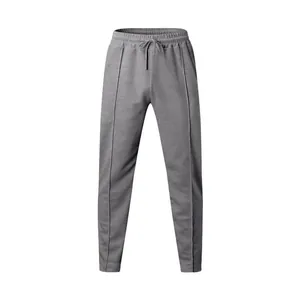 Premium grey men's sports joggers with stylish front crease seams and drawstring waist.