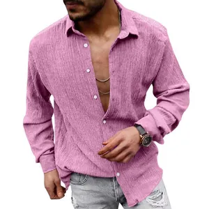 Close-up of men's pink long-sleeved seersucker casual shirt with unique textured fabric