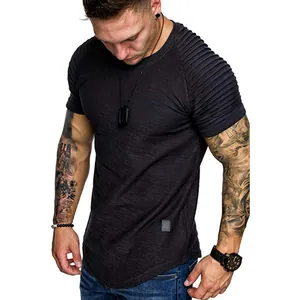 Detail view of men's slim fit t-shirt with unique textured pleated raglan sleeves.