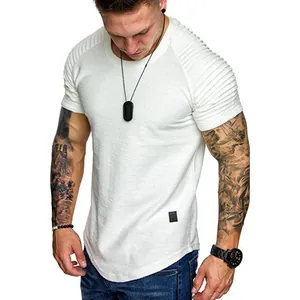 Detail view of slim-fit men's white T-shirt featuring pleated shoulder design