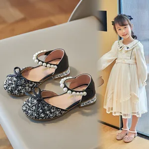 Elegant girls' glitter princess sandals featuring pearl straps and decorative bows.