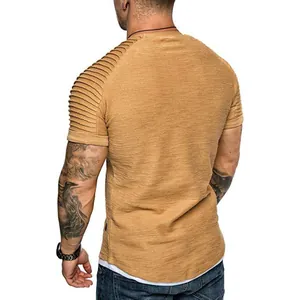 Detailed view of men's slim fit T-shirt featuring pleated raglan sleeves and texture