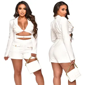 Elegant white deep V neck romper featuring utility pockets and chic cutout waist details