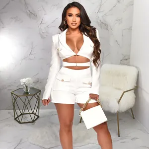 Elegant white two-piece fashion set featuring deep V-neck cropped blazer and shorts