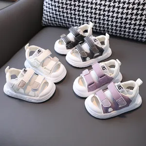 Detail view of toddler closed-toe sandals in multiple colors with mesh upper and velcro straps