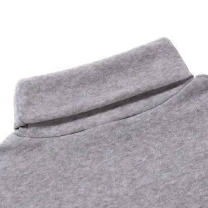 Detail view of the gray turtleneck collar showing soft knit fabric and stitching