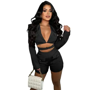 Detailed view of the black sexy deep V-neck jumpsuit with long sleeves and utility pockets