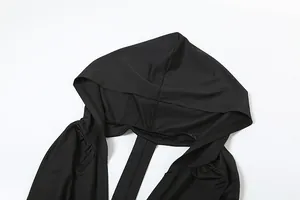 Macro detail view of the black hood and neckline on a slim fit sexy backless dress