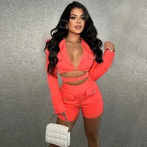 Detail view of sexy coral two-piece set with deep V-neck and cargo pocket shorts