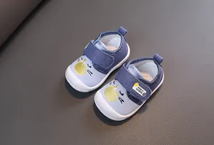 Detailed view of light blue cartoon squeaky baby walking shoes with corduroy texture