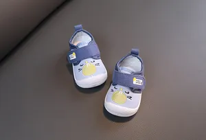 Detailed view of blue breathable cartoon squeaky walking shoes for toddlers aged 0-3 years