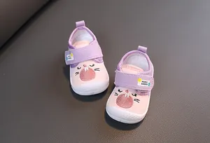 Top view detail of pink and purple cartoon cat baby walking shoes with soft velcro straps