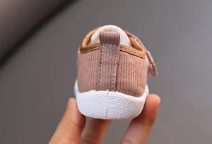 Close-up of the heel and textured sole on breathable baby squeaky walking shoes.