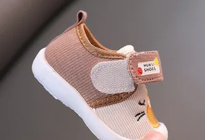 Close-up of breathable cartoon infant squeaky walking shoes with adjustable Velcro strap