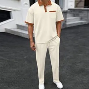 Full view of men's cream casual corduroy polo shirt and matching trousers set outdoor