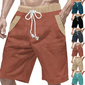 Detail view of men's corduroy shorts featuring drawstring waist and color variants