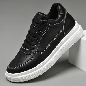 Classic black leather sneakers with white platform soles and elegant contrast stitching