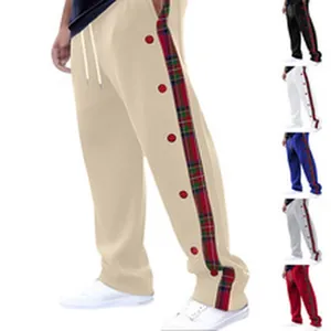 Detailed view of men's casual sweatpants with plaid side stripes and buttons
