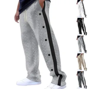 Stylish men's athletic sweatpants with side button snap details and drawstring waist