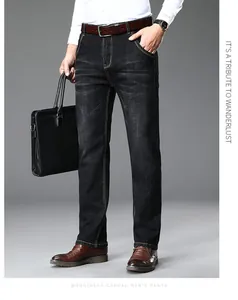 Detail view of men's straight-leg black jeans for a business casual look.