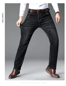 Close-up of men's dark stretch denim jeans showing high elasticity and straight leg fit