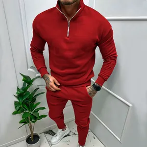 Detail of men's red leisure tracksuit featuring a half-zipper stand collar and cozy fleece