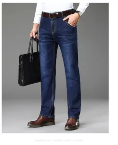 Men's business casual straight-leg jeans styled with briefcase and belt