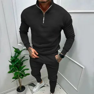 Men's casual black fleece tracksuit set featuring a quarter-zip top and jogger pants