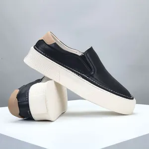 Classic men's black leather slip-on loafers with thick white platform sole design