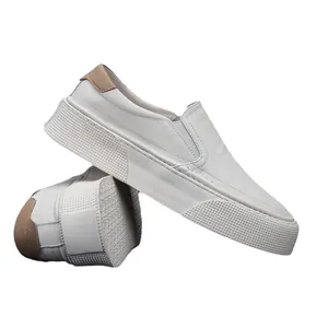 Men's white soft leather slip-on loafers with thick soles and breathable design.