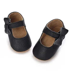 Classic black soft sole baby girl Mary Jane walking shoes featuring side bow detail