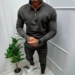 Men's dark grey quarter-zip fleece tracksuit set with matching joggers for autumn wear