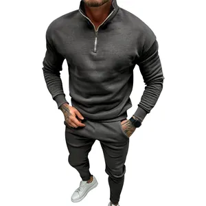 Detailed view of men's gray fleece tracksuit with half-zip sweatshirt and joggers