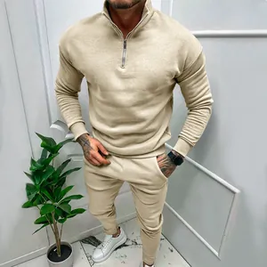 Detailed view of men's beige quarter-zip tracksuit set for athletic and casual wear