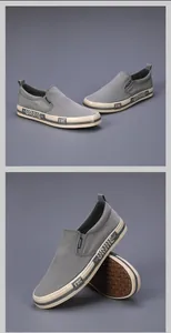 Detail view of grey washed canvas slip-on loafers for men with textured rubber sole