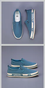Detail view of blue washed cloth slip-on shoes with white rubber soles