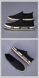 Detail view of men's black washed cloth slip-on loafers with flat rubber sole