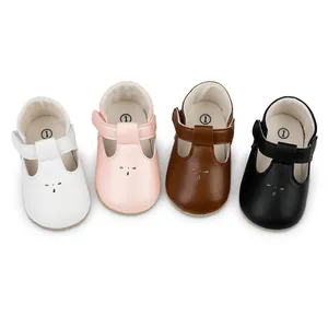 Collection of stylish baby T-strap walker shoes in white, pink, brown, and black colors