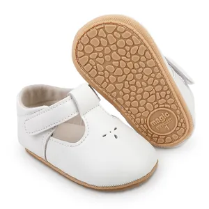 Detailed view of white baby prewalker shoes with anti-slip sole and Velcro strap