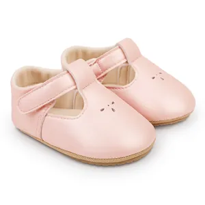 Close-up view of elegant pink baby princess walking shoes with T-strap velcro closure