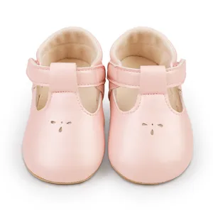 Detailed front view of soft pink T-strap baby princess walking shoes for infants