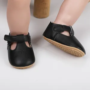 Detailed view of elegant black baby girl princess dress shoes with non-slip rubber sole