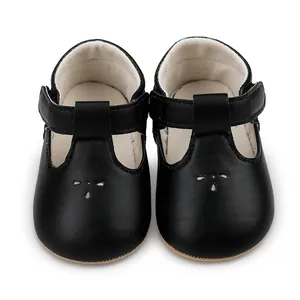 Classic black leather baby Mary Jane shoes with elegant hollow decorative pattern detail