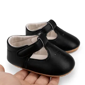 Detailed view of black T-strap baby walking shoes with high quality soft leather finish.