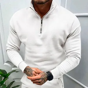 Detail view of white half-zip men's polo sweatshirt with stand collar and ribbed cuffs