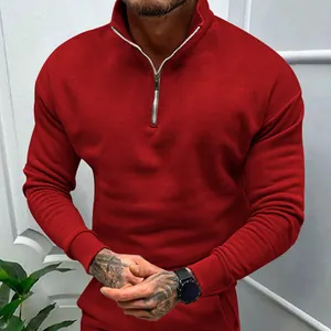 Detailed close-up of a red men's half-zip fleece sweatshirt featuring a stand collar design