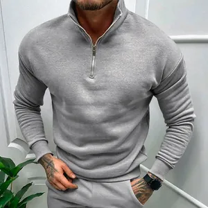 Detailed view of men's gray long-sleeved half-zip polo sweatshirt with stand collar