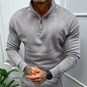 Detailed view of a men's grey fleece sweatshirt featuring a half-zip polo collar